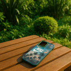 Phone case with palm tree design and Nike logo on a wooden table outdoors